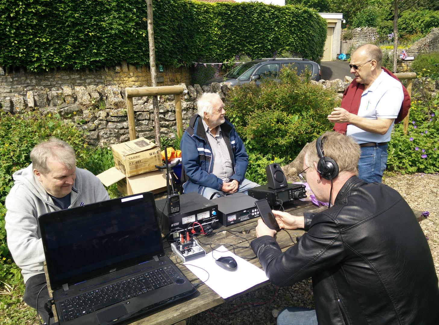 Downtime (left to right) Chris 2E0TBS, Ken G4XCB, visiting amateur and Mark M0SKV (facing away from the camera)